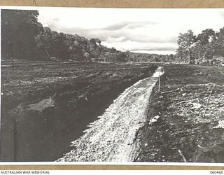 FINSCHHAFEN AREA, NEW GUINEA. 1943-11-09. GENERAL VIEW OF THE NEW BOMBER AIRSTRIP BEING CONSTRUCTED JOINTLY BY THE 808TH UNITED STATES ENGINEER AVIATION BATTALION AND THE 60TH UNITED STATES NAVAL ..