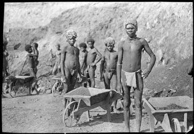 Several men with wheelbarrows at copper mine at Bootless Inlet [?], Papua, ca. 1923 / Sarah Chinnery