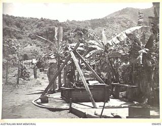 RABAUL, NEW BRITAIN, 1945-09-13. CONCRETE FOUNDATIONS OF THE KITCHEN OF 2/22ND INFANTRY BATTALION, WHICH FORMED PART OF THE AUSTRALIAN GARRISON BEFORE THE JAPANESE INVASION EARLY IN 1942. BY CHANCE ..