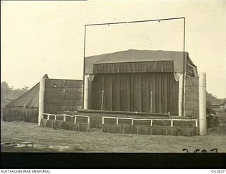 AITAPE, NORTH EAST NEW GUINEA. C. 1945. THIS IS THE OPEN AIR STAGE BUILT OF WASTE CASES AND SCRAP BY THE BOYS OF A RAAF BEAUFORT BOMBER SQUADRON. THE PLANS WERE DRAWN UP BY LEADING AIRCRAFTMAN JOHN ..