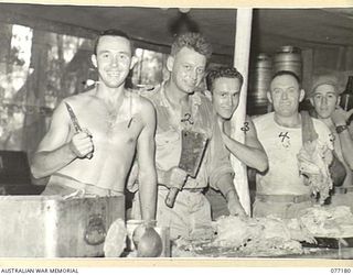 MALMAL MISSION, JACQUINOT BAY, NEW BRITAIN. 1944-11-24. COOKS OF B COMPANY, 594TH ENGINEER BOAT AND SHORE REGIMENT, UNITED STATES ARMY ATTACHED TO THE 5TH AUSTRALIAN DIVISION, PREPARE TO CUT UP THE ..