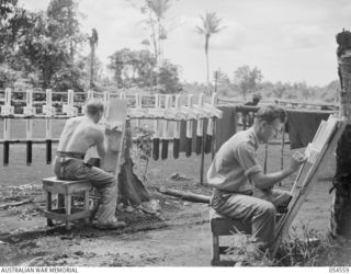 SOPUTA, NEW GUINEA, 1943-07-20. VX61395 CORPORAL F. J. GLEESON (LEFT) AND Q148237 PRIVATE N. G. CRESWELL OF THE 15TH AUSTRALIAN WAR GRAVES REGISTER AND ENQUIRY UNIT, PAINTING CROSSES