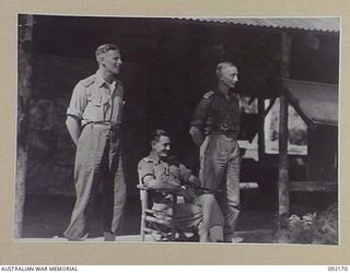 JACQUINOT BAY, NEW BRITAIN. 1945-05-18. OFFICERS OF G BRANCH, HEADQUARTERS 5 DIVISION. IDENTIFIED PERSONNEL ARE:- CAPTAIN C.H. POWDITCH (1); CAPTAIN R.D. DOUGLAS (2); CAPTAIN P.G. THOMPSON (3)