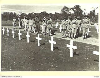 LAE, NEW GUINEA. 1944-04-23. MEMBERS OF THE AUSTRALIAN ARMY NURSING SERVICE FROM THE 2/7TH GENERAL HOSPITAL INSPECTING A SECTION OF THE LAE WAR CEMETERY AT THE CONCLUSION OF THE DEDICATION CEREMONY ..