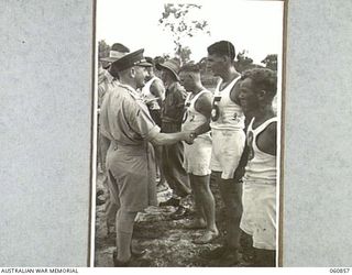 NEW GUINEA. 1943-11-20. NX8 LIEUTENANT GENERAL SIR LESLIE MORSHEAD KCB KBE CMG DSO ED, GENERAL OFFICER COMMANDING. NEW GUINEA FORCE CONGRATULATING THE WINNERS OF THE VARIOUS EVENTS AT THE ..