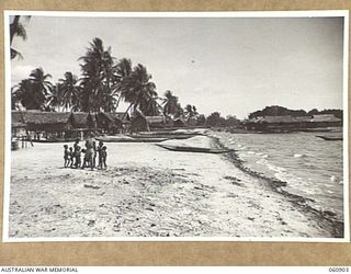 PA PA, PAPUA. 1943-12-02. GENERAL VIEW OF THE NATIVE VILLAGE LOOKING ALONG THE BEACH