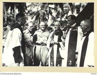 NORTH ALEXISHAFEN, NEW GUINEA. 1944-08-10. THE CONFIRMING BISHOP TALKING WITH HIS ASSISTANT CHAPLAINS BEFORE THE COMMENCEMENT OF THE CONFIRMATION CEREMONY OF SOME 50 MEMBERS OF THE 8TH INFANTRY ..