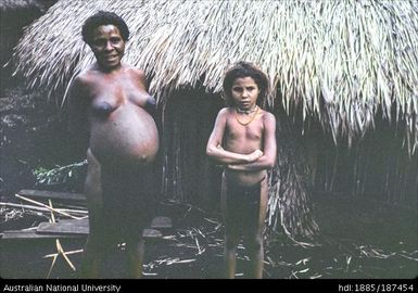 Half-caste child with mother and sisters