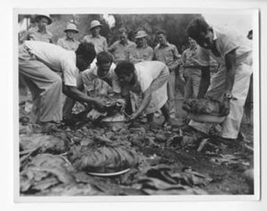 [South Pacific Natives Moving Food]