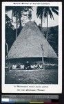 Missionary father sits with children in front of a thatched dome, New Caledonia, ca.1900-1930