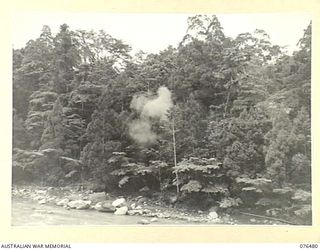 BUSU RIVER, NEW GUINEA. 1944-10-07. BOMBS EXPLODING AMONG THE SCRUB ALONG THE RIVER DURING AN ARMY-AIR CO-OPERATION EXERCISE WITH THE 2/8TH COMMANDO SQUADRON AND NO.4 TACTICAL RECONNAISSANCE ..