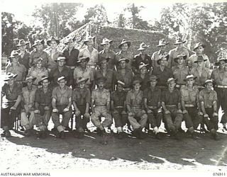 LAE, AREA, NEW GUINEA. 1944-11-18. PERSONNEL OF THE MOTOR TRANSPORT SECTION, NO.2 PLATOON, 2/7TH ADVANCED WORKSHOPS, NON COMMISSIONED OFFICER IN CHARGE, VX22050 SERGEANT R. MCEACHERN