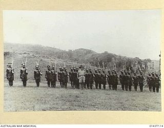 1943-03-03. NATIVE CONSTABLES WHO FORMED A GUARD OF HONOR AT WAU AERODROME, WHEN FOUR OF THEIR NUMBER RECEIVED LOYAL SERVICE MEDALS. NATIVES EXCEL AT DRILL IN WHICH THEY CAN DISPLAY RHYTHMIC ..