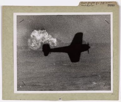 Photograph of a Japanese Plane Struck By Coast Guard-manned Landing Craft