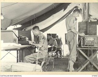 ALEXISHAFEN, NEW GUINEA. 1944-09-14. THE CONTROL OFFICE OF THE 133RD BRIGADE ORDNANCE FIELD PARK. IDENTIFIED PERSONNEL ARE:- NX156671 CORPORAL R.H. REILLY (1); NX110624 STAFF SERGEANT S.N. MOONEY ..