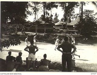 A BASKET BALL MATCH IN PROGRESS AT HEADQUARTERS, 23RD INFANTRY BRIGADE BETWEEN PERSONNEL OF THE HEADQUARTERS STAFF AND MEMBERS OF A ROYAL NEW ZEALAND AIR FORCE SQUADRON