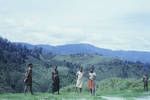 [Group of men with mountain ranges behind] Western Highlands, NG, May 1963