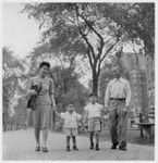 Walking along Riverside Drive in New York City are members of three generations of the Saiki family, voluntary evacuees from