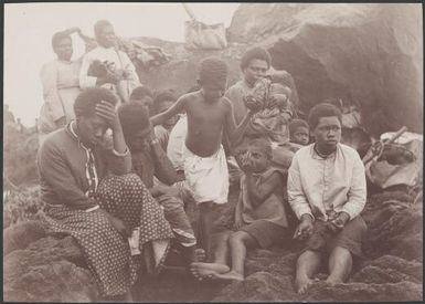 Women and children on the landing rock at Merelava, Banks Islands, 1906 / J.W. Beattie