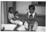 Women and children on verandah