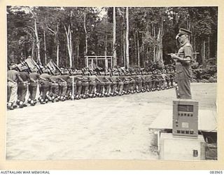 TOROKINA, BOUGAINVILLE, SOLOMON ISLANDS. 1944-12-15. MAJOR GENERAL W. BRIDGEFORD, GENERAL OFFICER COMMANDING 3 DIVISION, (1), TAKING THE SALUTE FROM D COMPANY, 47 INFANTRY BATTALION, 29 INFANTRY ..