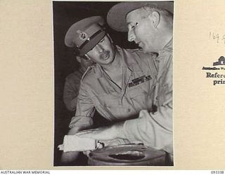LAE AREA, NEW GUINEA, 1945-06-30. DURING HIS TOUR OF INSPECTION OF AUSTRALIAN TROOPS IN THE LAE AREA, HIS ROYAL HIGHNESS, THE DUKE OF GLOUCESTER, GOVERNOR-GENERAL OF AUSTRALIA (1) VISITED 8 FIELD ..