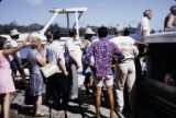 French Polynesia, tourists boarding boat on dock of Bora Bora