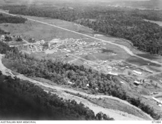 LAE, NEW GUINEA. 1944-03-30. AN AERIAL VIEW OF THE TOWN SHOWING THE 2/7TH AUSTRALIAN GENERAL HOSPITAL (TO THE LEFT), THE 2/8TH AUSTRALIAN GENERAL HOSPITAL, (TO THE RIGHT), AND THE BUSU RIVER IN THE ..