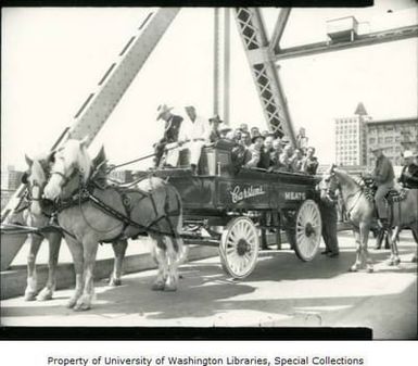 Group of Hawaii business leaders on a goodwill tour in Carsten's Packing Company horse-drawn meat wagon, August 8, 1947