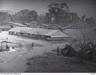 LAE, NEW GUINEA. 1945-12. EXTERIOR VIEW OF MENS RECREATION HUT AT 4TH ADVANCED ORDNANCE DEPOT SEEN FROM THE WATER TOWER. (DONOR: J. W. K. BEDDOME)