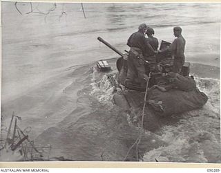 BOUGAINVILLE. 1945-03-30. A MATILDA TANK OF B SQUADRON, 2/4 ARMOURED REGIMENT, ENTERING THE PURIATA RIVER DURING THE MOVE FORWARD TO SUPPORT 25 INFANTRY BATTALION