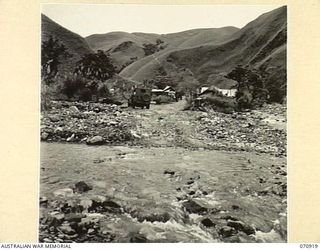 WAU - LAE ROAD, NEW GUINEA, 1944-02-26. A FORD ON THE ROAD APPROXIMATELY 41 MILES FROM WAU, SHOWING THE APPROACHES TO THE CAMP OF THE 2/9TH FIELD COMPANY, ROYAL AUSTRALIAN ENGINEERS AT ZENAG