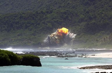 A fireball rises above the 36th Explosive Ordnance Disposal (EOD) Tarague range seconds after the detonation of an M117 bomb, as a part of the flight's training, on Andersen Air Force Base (AFB), Guam