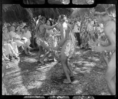 Unidentified local dancers, possibly including Augustine, perform the hula at a ceremony feast, Tahiti