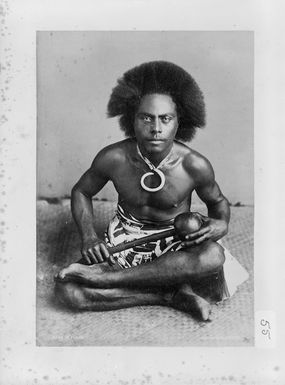 Unidentified Fijian warrior with a club in his hand