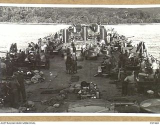 FINSCHHAFEN, NEW GUINEA, 1943-09-22. FINSCHHAFEN FORCE LSI. (LANDING SHIP INFANTRY) APPROACHING THE ASSAULT BEACH