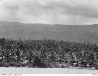 WUNUNG PLANTATION, NEW BRITAIN. 1945-02-27. PART OF A PANORAMA OF THE PLANTATION AREA SHOWING THE CAMPS OF THE 4TH INFANTRY BRIGADE AND THE 472ND HEAVY ANTI AIRCRAFT BATTERY. JOINS PHOTOGRAPHS NO. ..