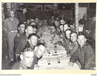 TOKO, BOUGAINVILLE. 1945-08-28. STAFF OFFICERS OF HEADQUARTERS 3 DIVISION AT THE DINNER HELD TO CELEBRATE VICTORY OVER JAPAN. IT WAS ATTENDED BY MAJOR GENERAL W. BRIDGEFORD, GENERAL OFFICER ..