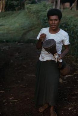 [Man with drum in Papua New Guinea]