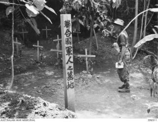 RABAUL, NEW BRITAIN, 1945-09-11. IN THE COURSE OF SECURING THE RABAUL AREA FOLLOWING LANDINGS BY TROOPS OF 4 INFANTRY BRIGADE ON 1945-09-10 A CEMETERY WAS DISCOVERED OFF TUNNEL HILL ROAD. THE ..
