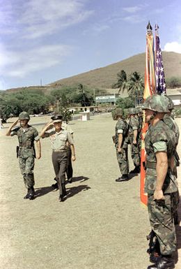 LGEN Choi Ki Duk, second vice chief of naval operations, Korea, salutes the flag as he passes the 1ST Marine Brigade Honor Guard welcoming him for a visit