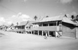 Guam, girl walking through village