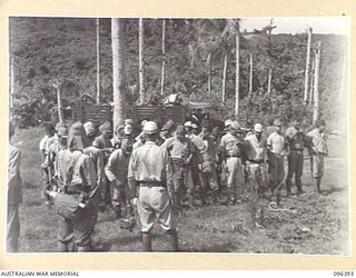 KAIRIRU ISLAND, NEW GUINEA, 1945-09-11. JAPANESE NAVAL PERSONNEL WHO ARE BEING TRANSFERRED FROM KAIRIRU TO MUSCHU ISLAND. FOLLOWING THE SURRENDER OF THE JAPANESE THE ISLANDS ARE NOW UNDER THE ..