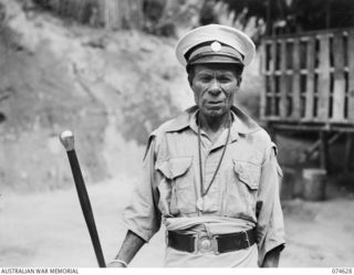 BASAMA-LAE AREA. NEW GUINEA. 1944-07-13. KING BUMBU, HEREDITERY CHIEF OF THE HUON GULF NATIVES. KING BUMBU WAS ARRESTED BY THE JAPANESE FOR HIS REFUSAL TO ASSIST THEM DURING THEIR OCCUPATION OF THE ..