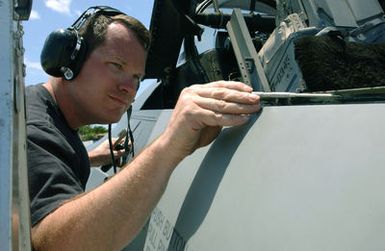 Wisconsin Air National Guard (WIANG) MASTER Sergeant (MSGT) Thomas Gates, 115th Fighter Wing (FW), Truax Field, Madison, Wisconsin (WI), replaces the canopy seal on one of the units deployed F-16C Fighting Falcon fighter aircraft at Hickam Air Force Base (AFB), Hawaii (HI). The 115th FW deployed eight Falcon's in support of Exercise SENTRY ALOHA