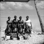 A group portrait of women in identical dress