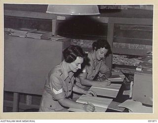 LAE, NEW GUINEA, 1945-05-16. AUSTRALIAN WOMEN'S ARMY SERVICE CIPHER OPERATORS WORKING IN THE CIPHER ROOM, SIGNALS, HEADQUARTERS FIRST ARMY. AUSTRALIAN WOMEN'S ARMY SERVICE PERSONNEL ARE TAKING OVER ..