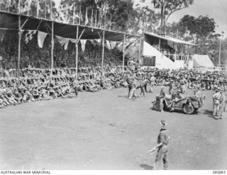 HERBERTON, QLD. 1945-01-20. MAJOR MCGEOCH, (10, AUCTIONING HORSES AT HQ 9 DIVISION GYMKHANA AND RACE MEETING HELD AT HERBERTON RACECOURSE. PURCHASE WAS RESTRICTED TO ARMY PERSONNEL OPERATING EITHER ..