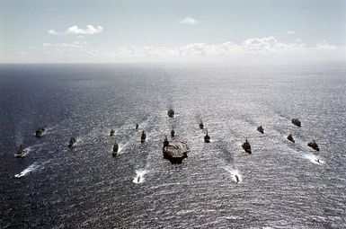 Twenty-one warships lead by NIMITZ Class Aircraft Carrier USS ABRAHAM LINCOLN (CVN 72) cruise in parade formation off the west coast of the island of Oahu, Hawaii. The ships are participants in RIMPAC 2000, the largest maritime exercise in the Asia-Pacific region, bringing together military forces from seven different nations