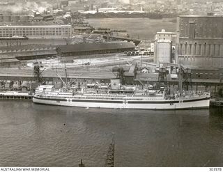 SYDNEY, NSW. 1941-11-10. AERIAL STARBOARD SIDE VIEW OF THE 2/1 AUSTRALIAN HOSPITAL SHIP MANUNDA WHICH WAS BOMBED AND HEAVILY DAMAGED IN DARWIN HARBOUR BY JAPANESE AIRCRAFT ON 1942-02-19. ON THE ..